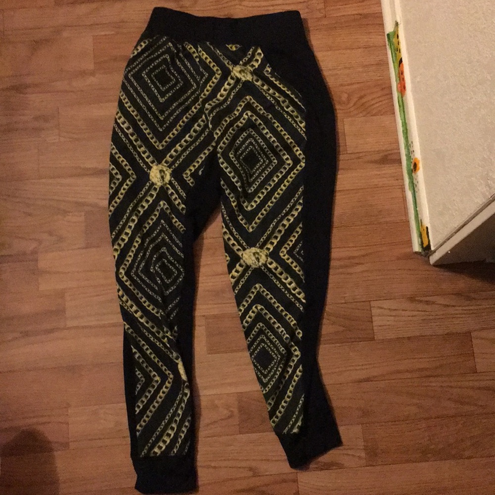 A gold chain sweat pants